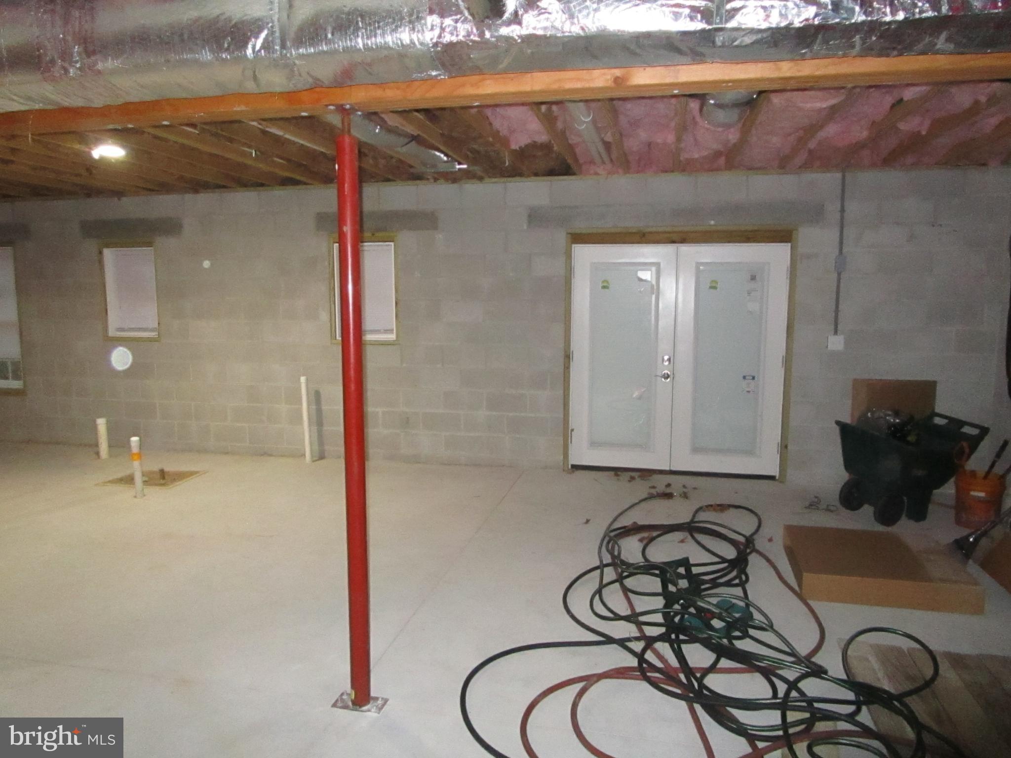 32 Tiffany Drive Rehoboth Beach, DE 19971 - Photo 35 of 43 a bathroom with a granite countertop sink and a mirror