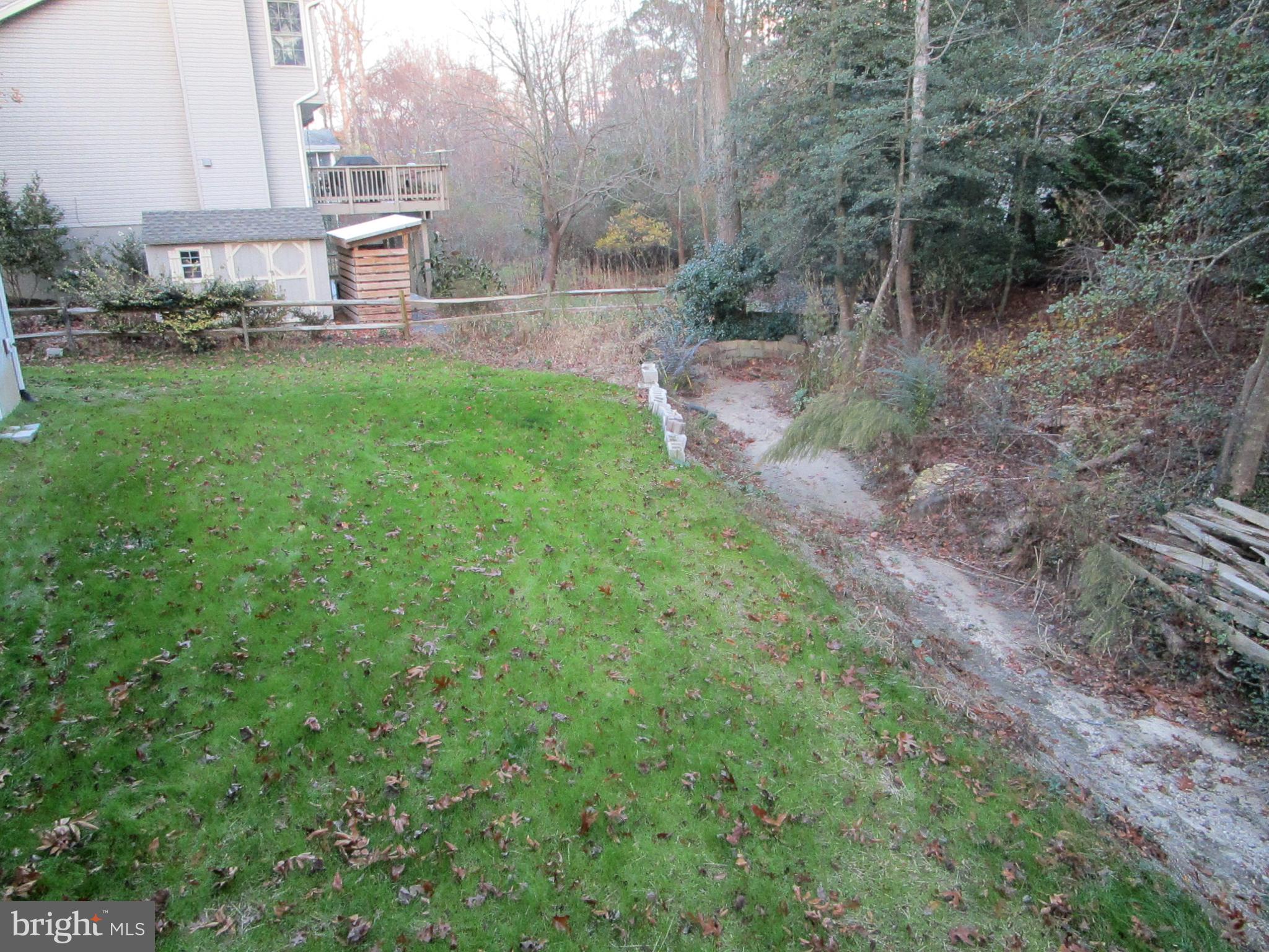 32 Tiffany Drive Rehoboth Beach, DE 19971 - Photo 8 of 43 a view of a back yard
