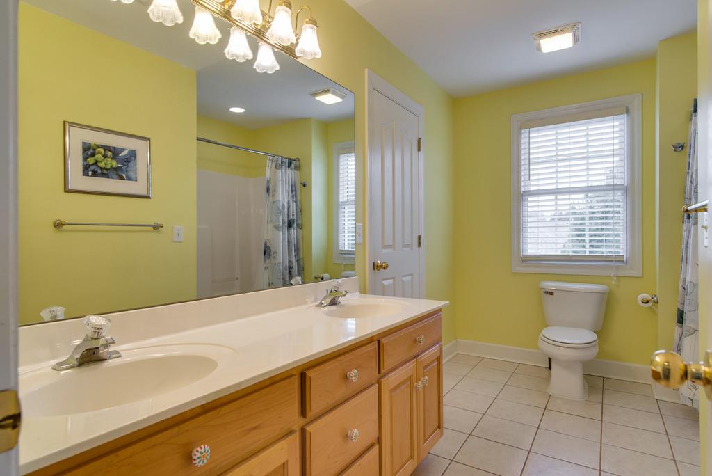 141 Mann Road Lebanon, TN 37087 - Photo 22 of 30 a bathroom with a double vanity sink mirror and toilet