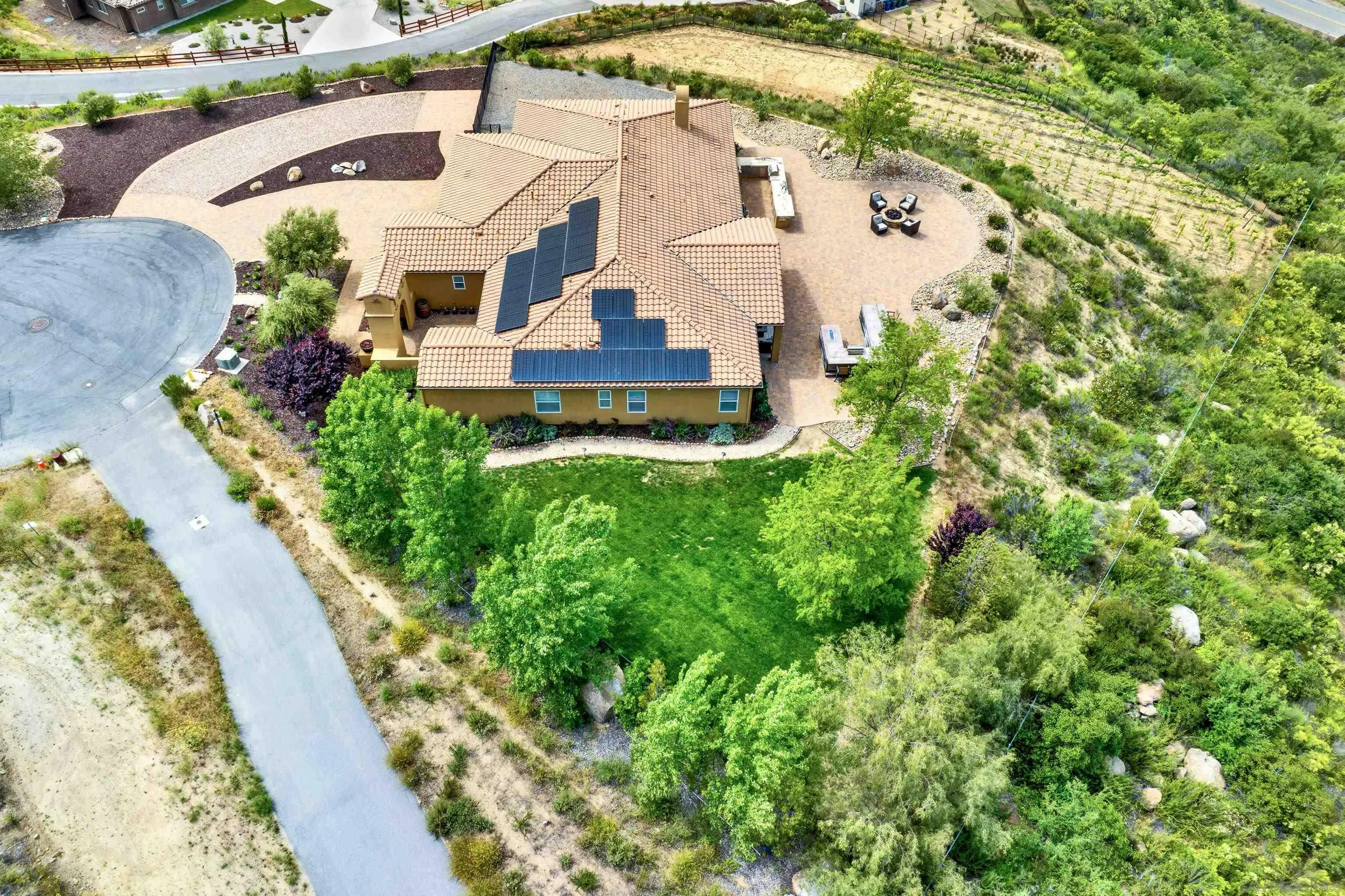 an aerial view of residential houses with outdoor space