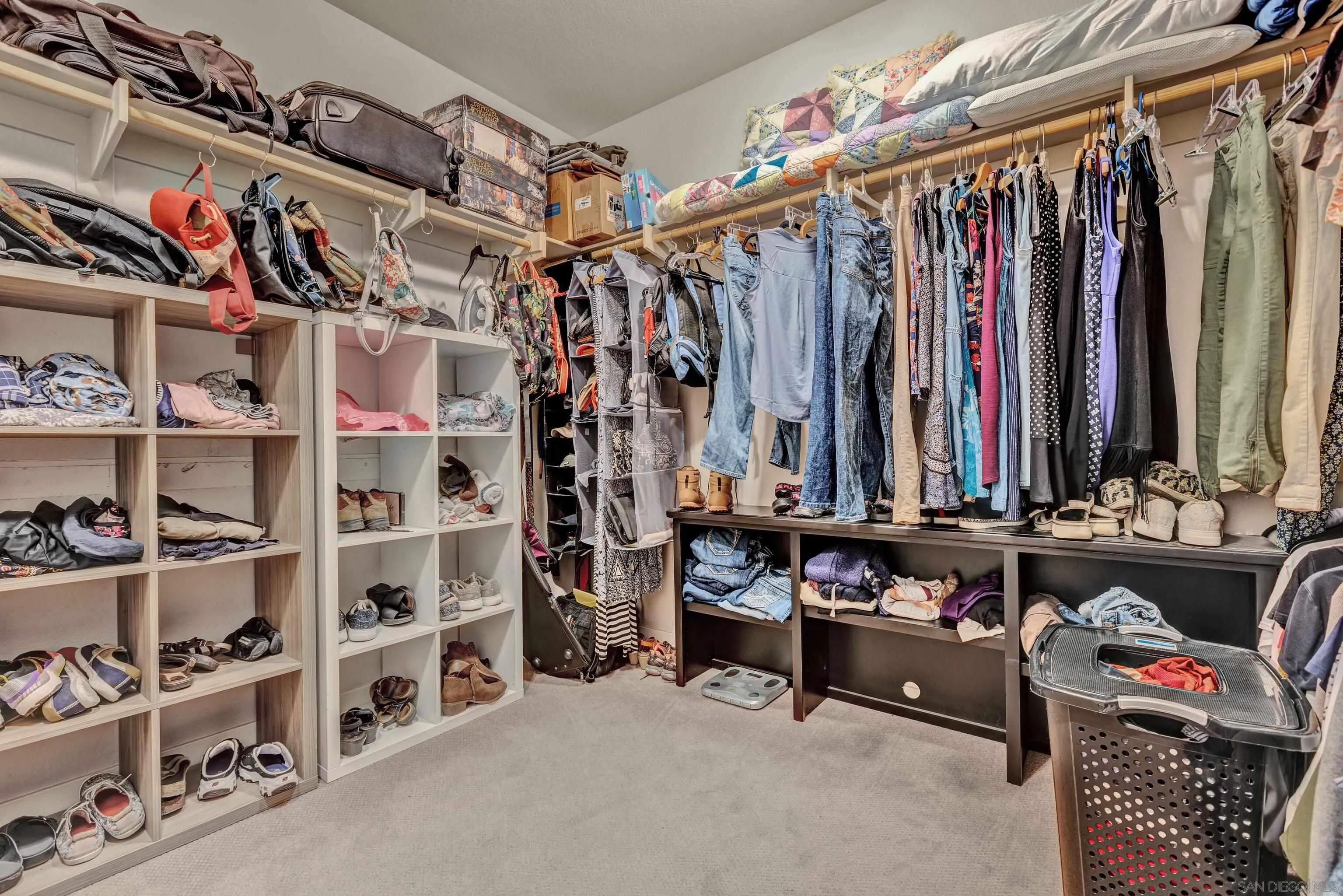 12884 Vineyard Crest Place Lakeside, CA 92040 - Photo 14 of 53 a view of walk in closet with clothes and shoes