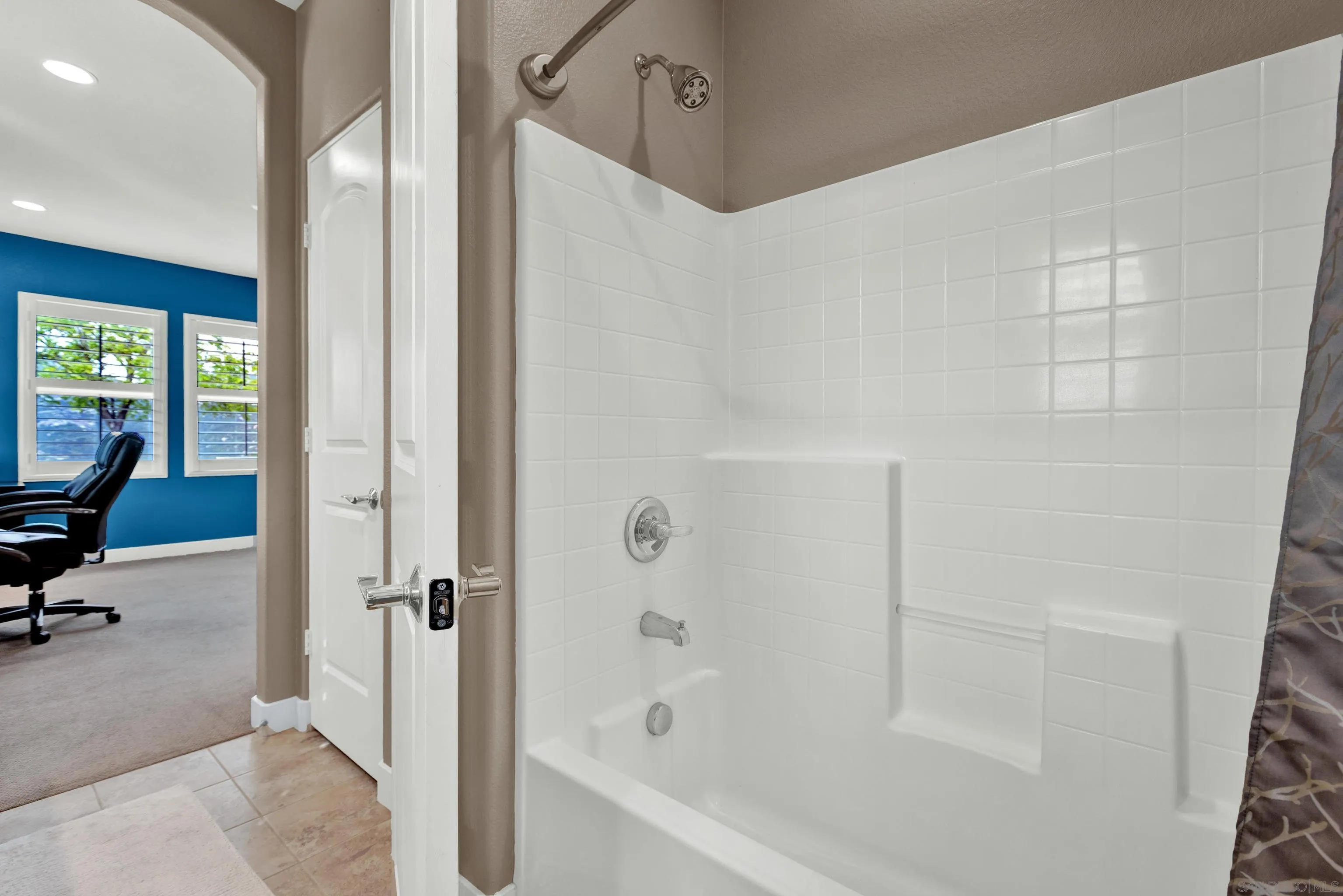 12884 Vineyard Crest Place Lakeside, CA 92040 - Photo 36 of 53 a bathroom with a bathtub and a shower