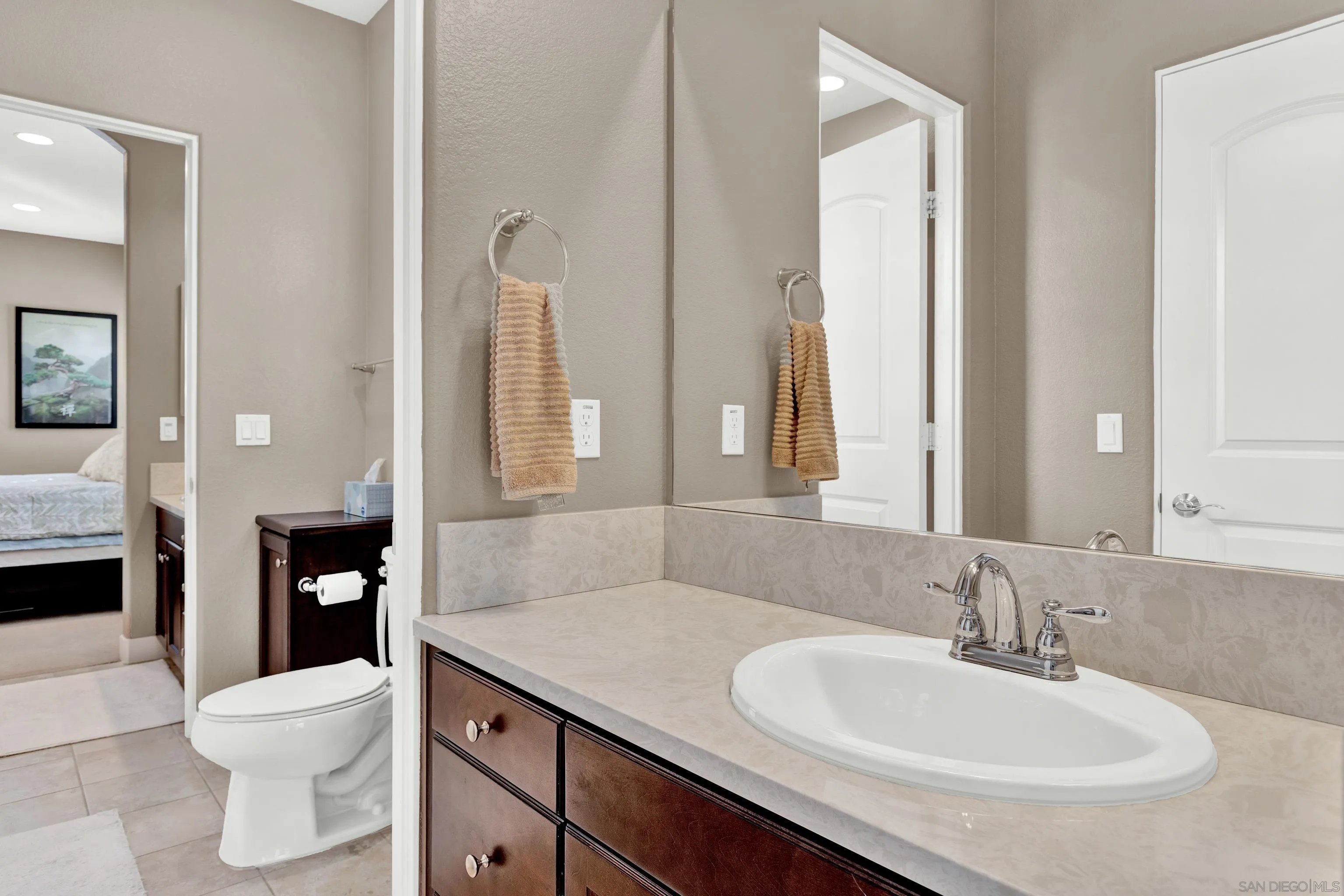 12884 Vineyard Crest Place Lakeside, CA 92040 - Photo 37 of 53 a bathroom with a granite countertop sink toilet and shower