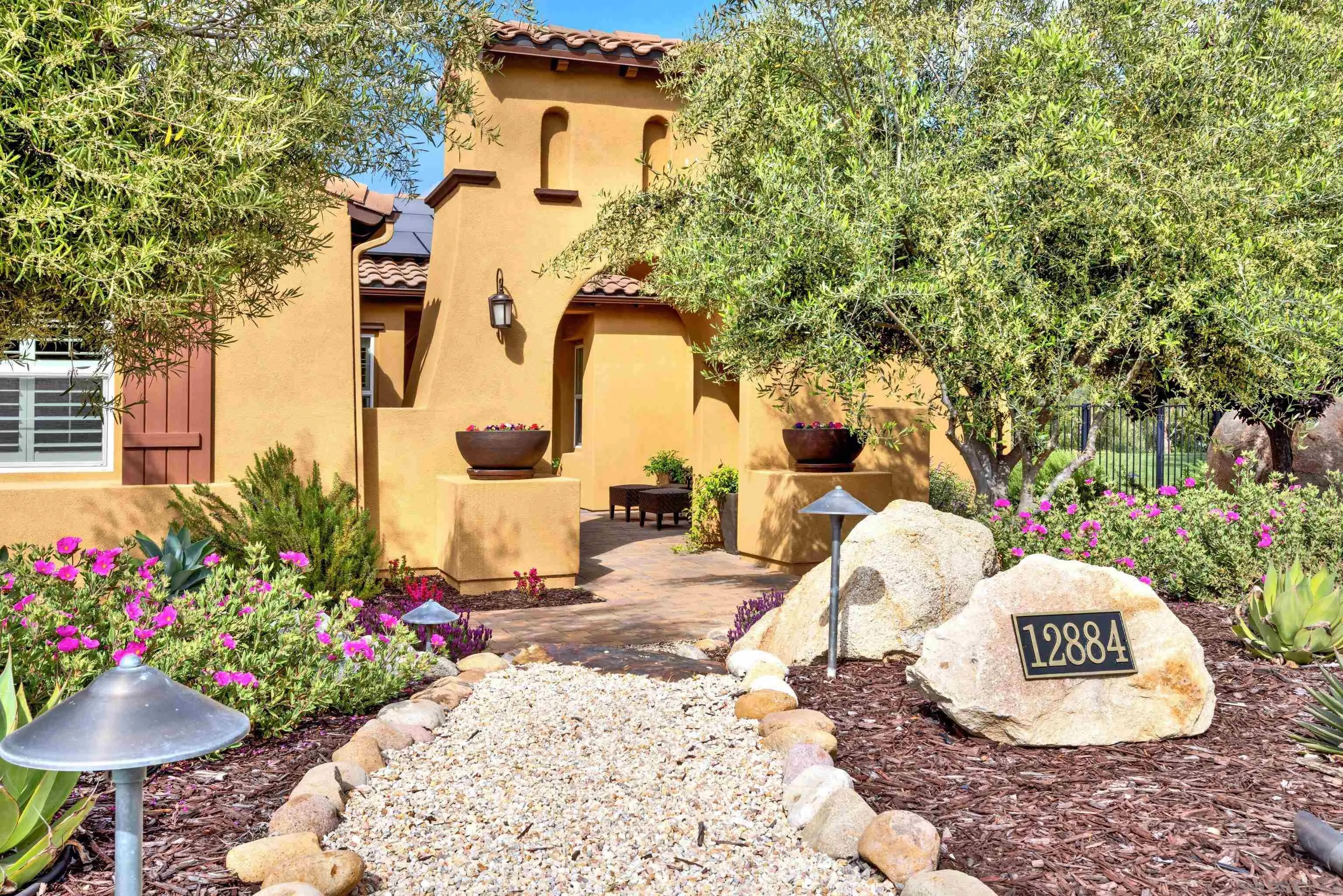 12884 Vineyard Crest Place Lakeside, CA 92040 - Photo 4 of 53 a front view of a house with a yard