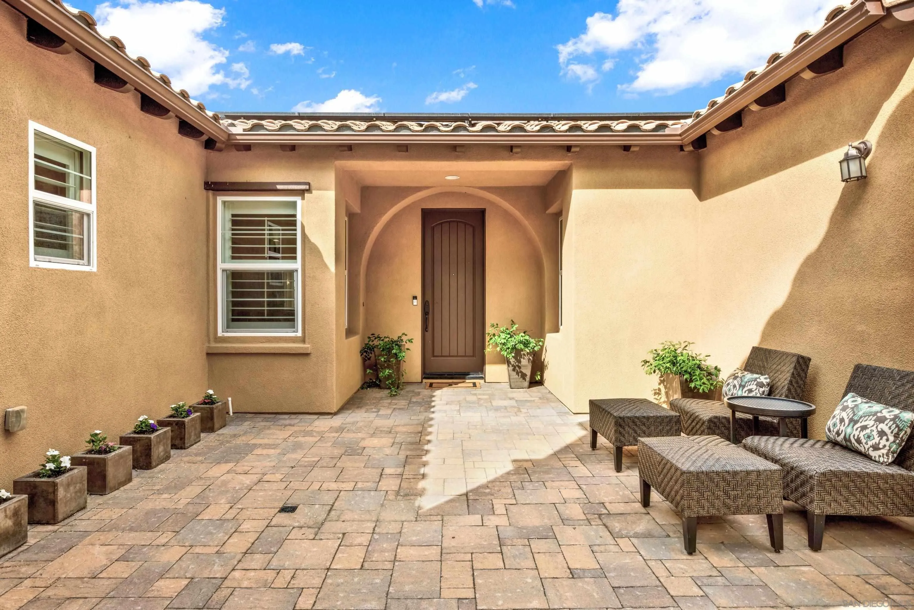 12884 Vineyard Crest Place Lakeside, CA 92040 - Photo 6 of 53 a view of a patio with a dining table and chairs