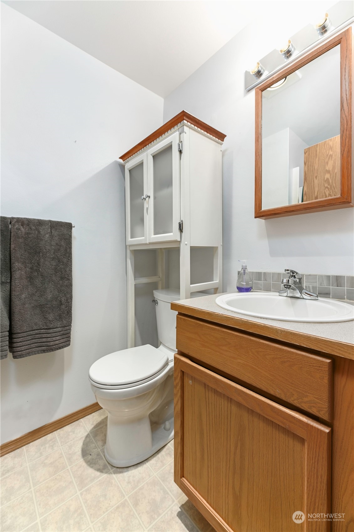 1105 Kessler Drive Sultan, WA 98294 - Photo 15 of 25 a bathroom with a sink toilet and mirror