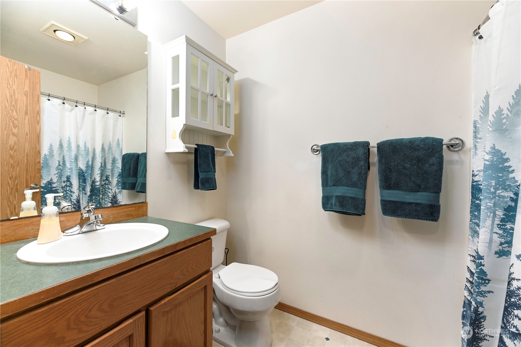 1105 Kessler Drive Sultan, WA 98294 - Photo 18 of 25 a bathroom with a sink and a mirror