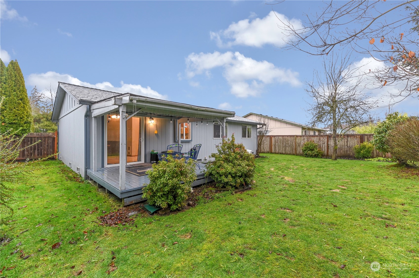 1105 Kessler Drive Sultan, WA 98294 - Photo 20 of 25 a view of a house with brick walls and a small yard