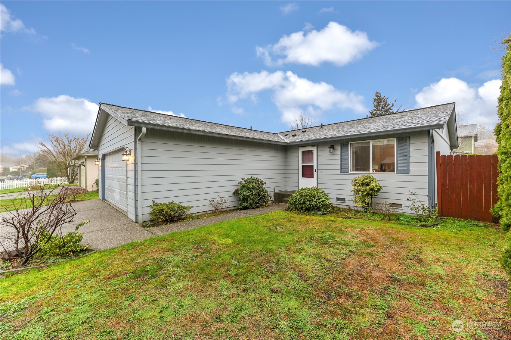 1105 Kessler Drive Sultan, WA 98294 - Photo 2 of 25 a view of a backyard with plants and large tree