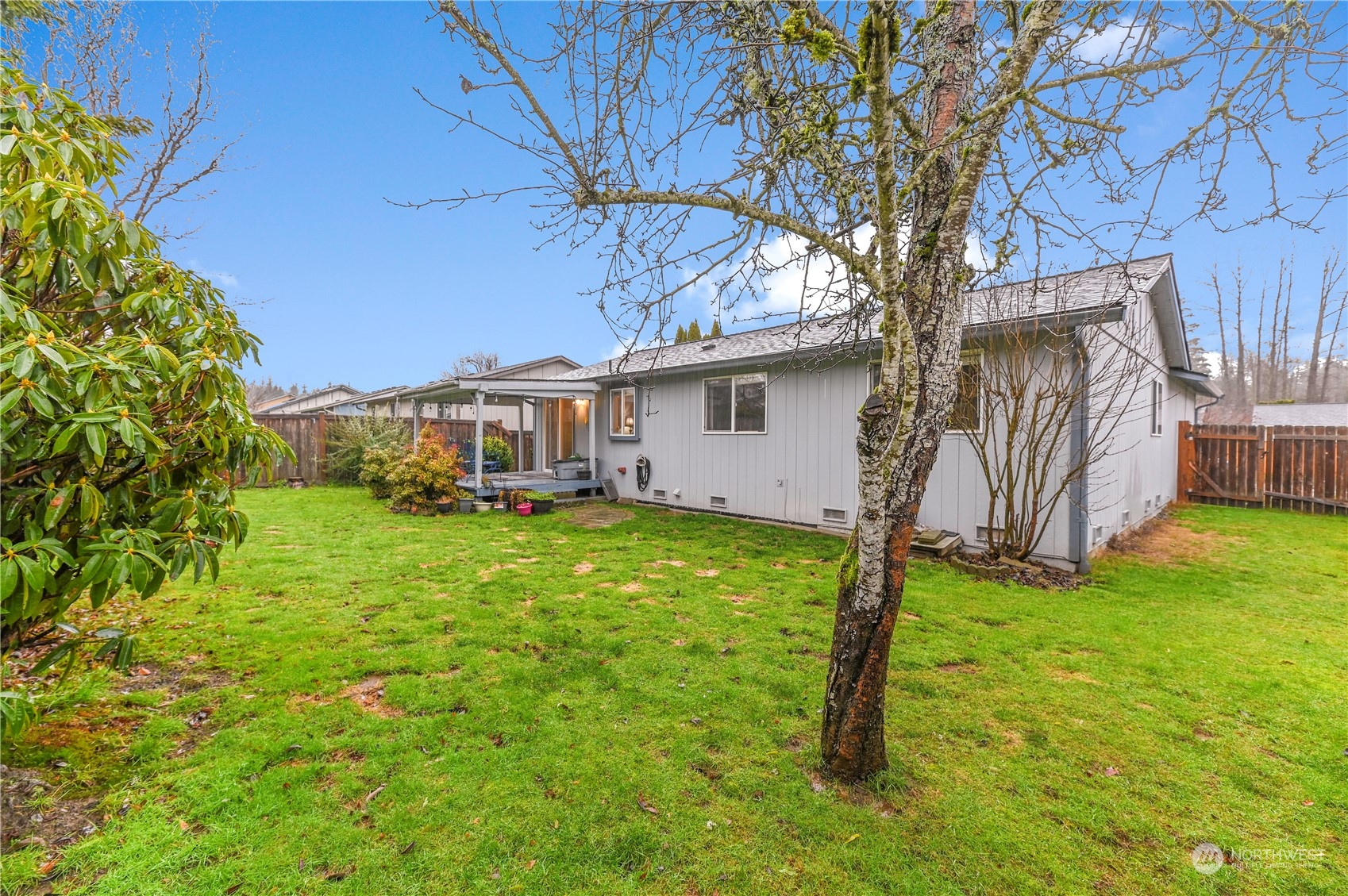 1105 Kessler Drive Sultan, WA 98294 - Photo 24 of 25 a backyard of a house with table and chairs