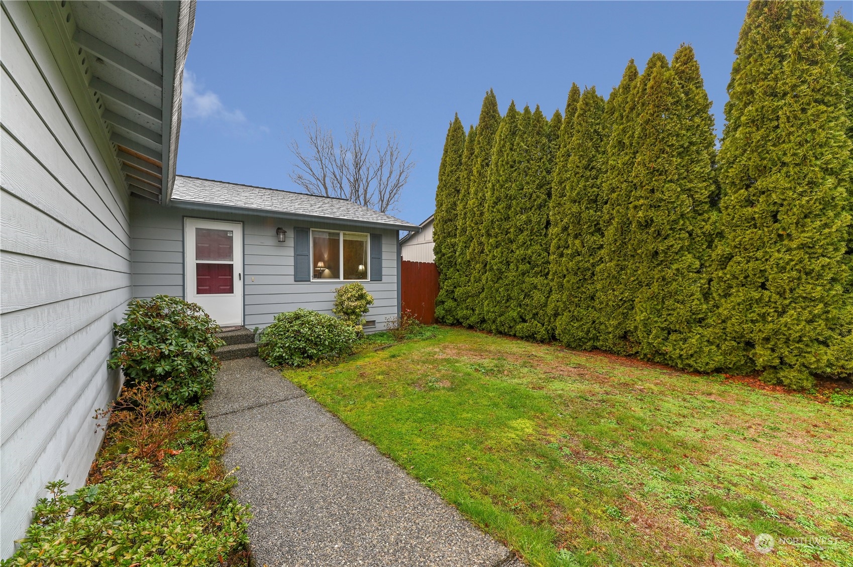1105 Kessler Drive Sultan, WA 98294 - Photo 3 of 25 a view of a backyard with potted plants and a fountain