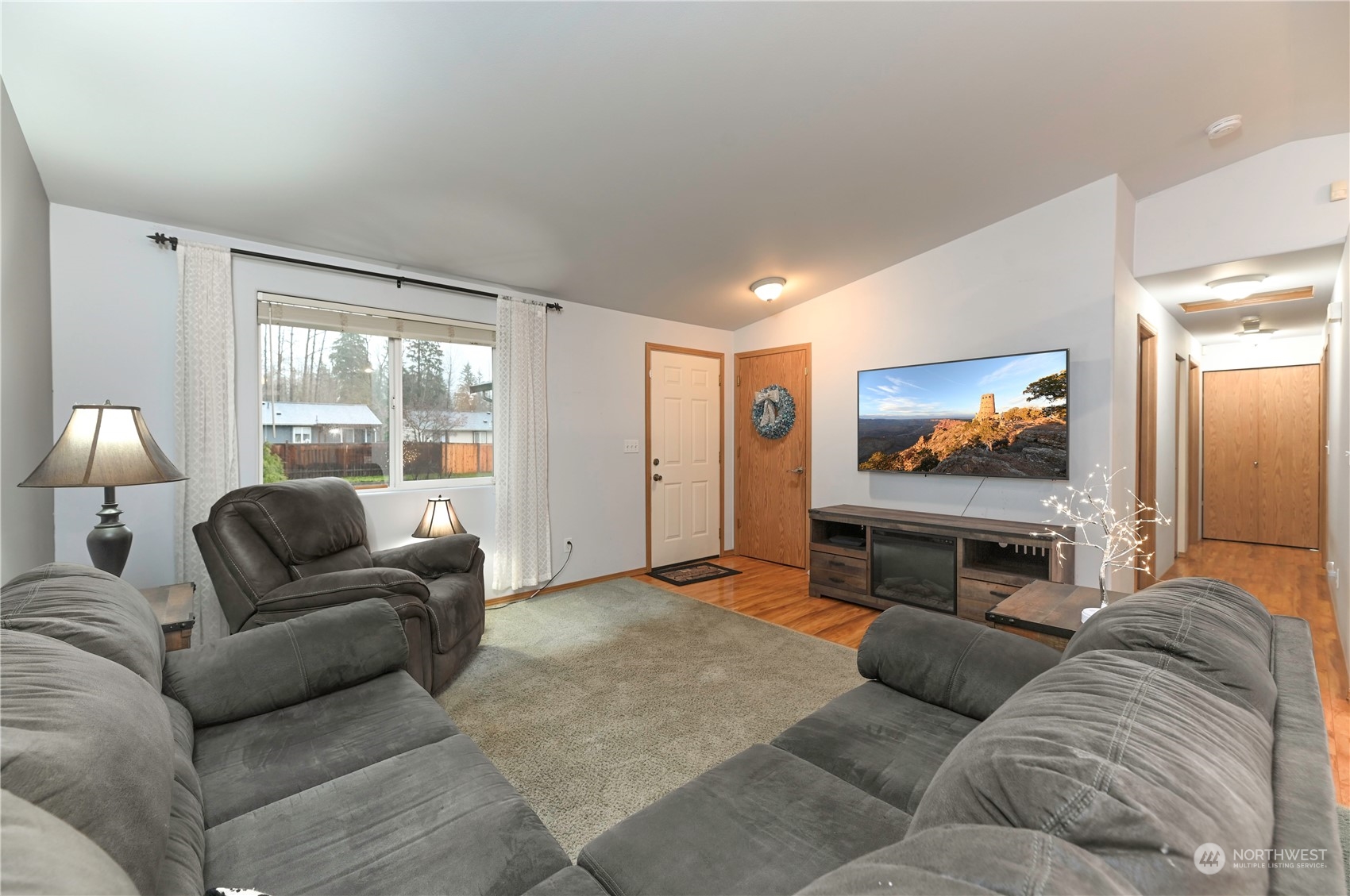 1105 Kessler Drive Sultan, WA 98294 - Photo 4 of 25 a living room with furniture and a flat screen tv