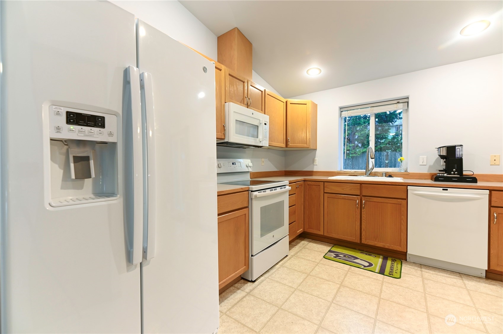 1105 Kessler Drive Sultan, WA 98294 - Photo 9 of 25 a kitchen with a sink cabinets and window