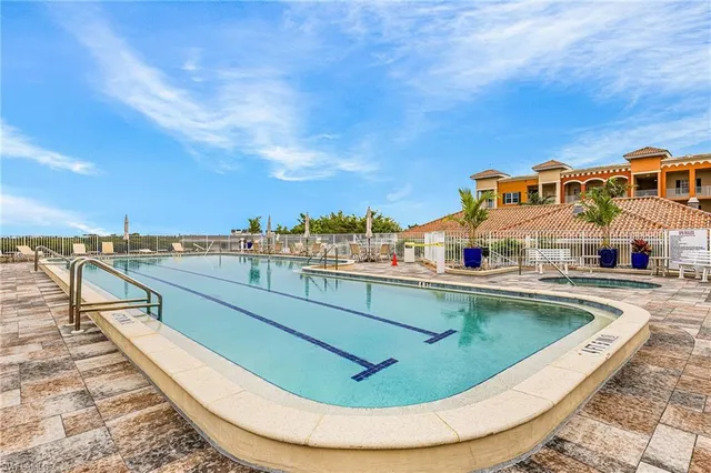 a view of a swimming pool with a lounge chair