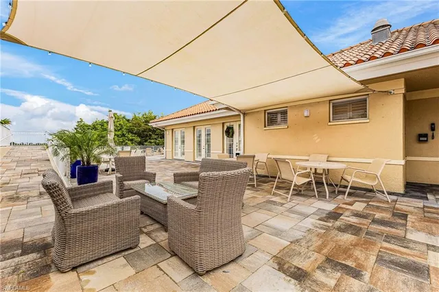 a view of a patio with couches and potted plants