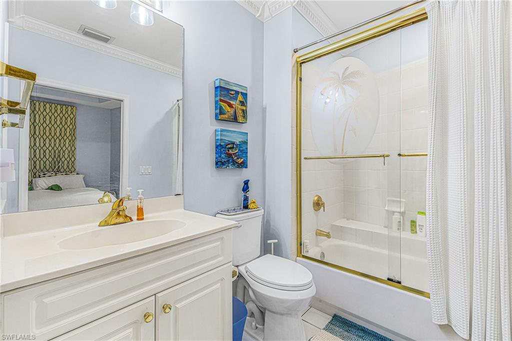 451 Bayfront Place, Unit 5503 Naples, FL 34102 - Photo 18 of 22 a bathroom with a sink a toilet and shower
