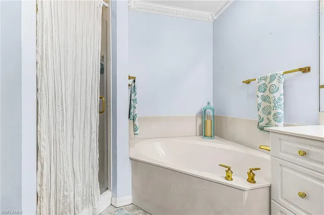 a bathroom with a tub and sink