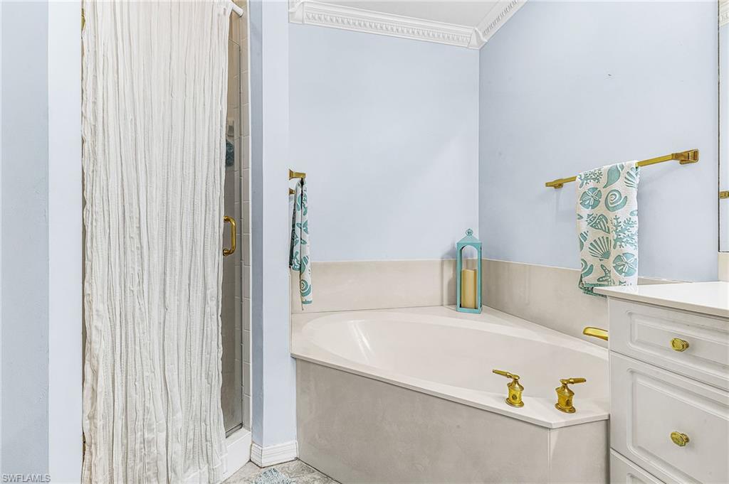 451 Bayfront Place, Unit 5503 Naples, FL 34102 - Photo 19 of 22 a bathroom with a tub and sink