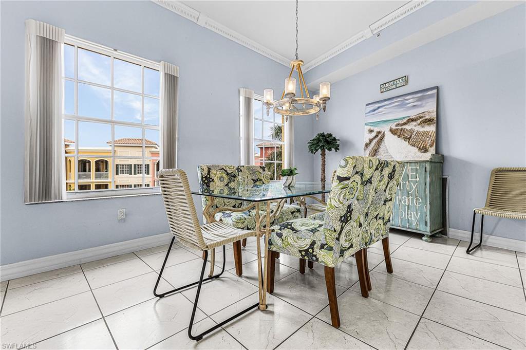 451 Bayfront Place, Unit 5503 Naples, FL 34102 - Photo 4 of 22 a view of a dining room with furniture and chandelier