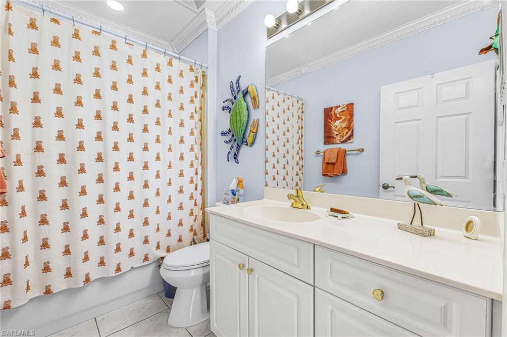 451 Bayfront Place, Unit 5503 Naples, FL 34102 - Photo 10 of 22 a bathroom with a sink toilet and shower