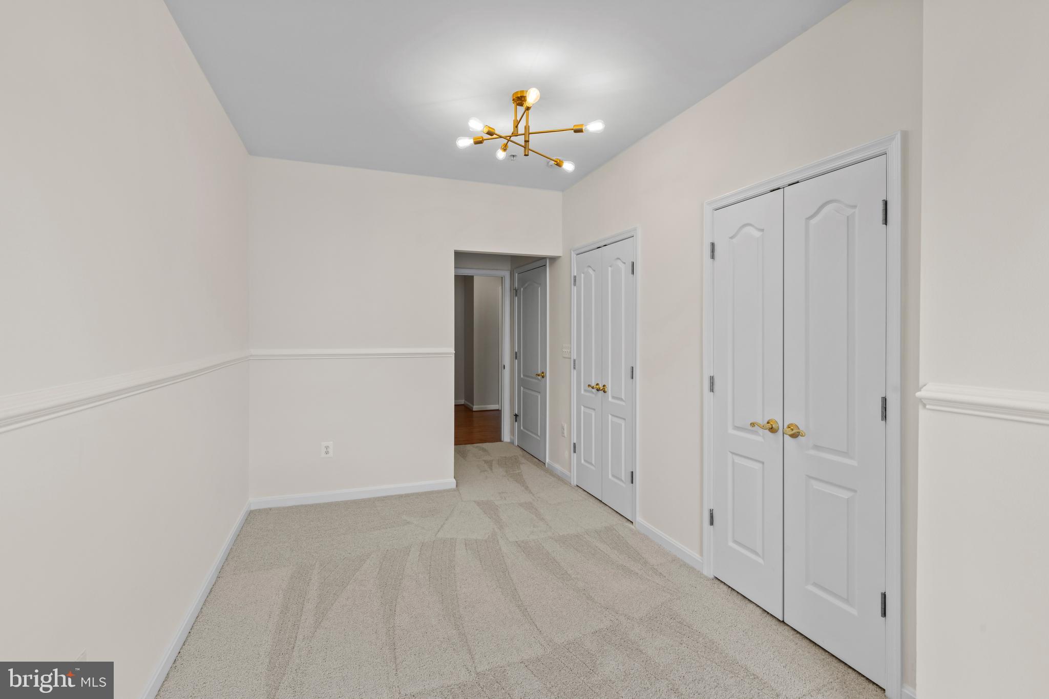 7315 Brookview Road, Unit 407 Elkridge, MD 21075 - Photo 21 of 33 a view of a chandelier fan and entryway