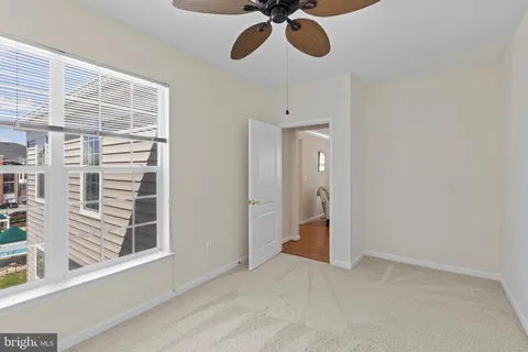 a view of a room with a air conditioner and windows