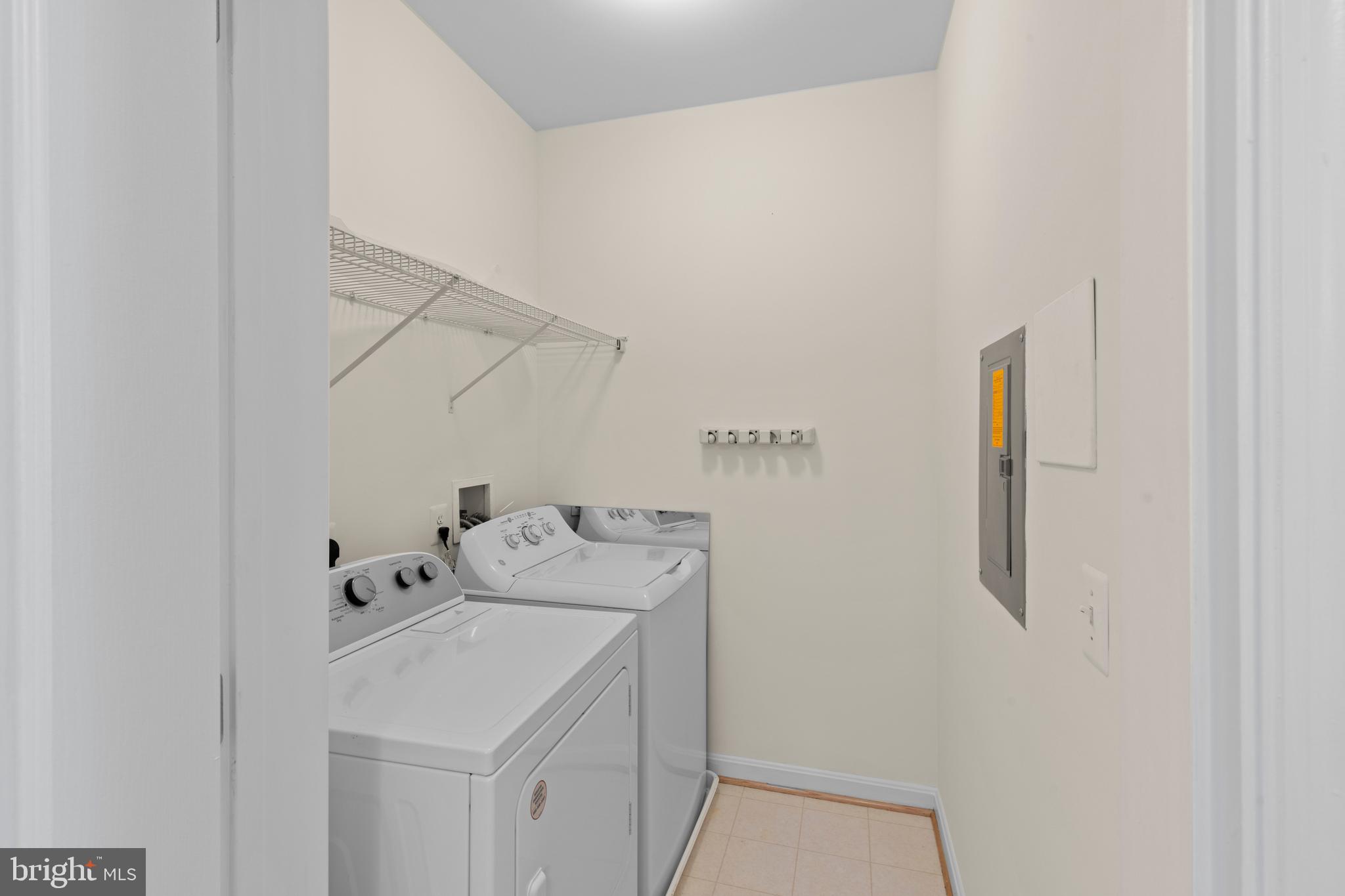 7315 Brookview Road, Unit 407 Elkridge, MD 21075 - Photo 25 of 33 a utility room with dryer and washer