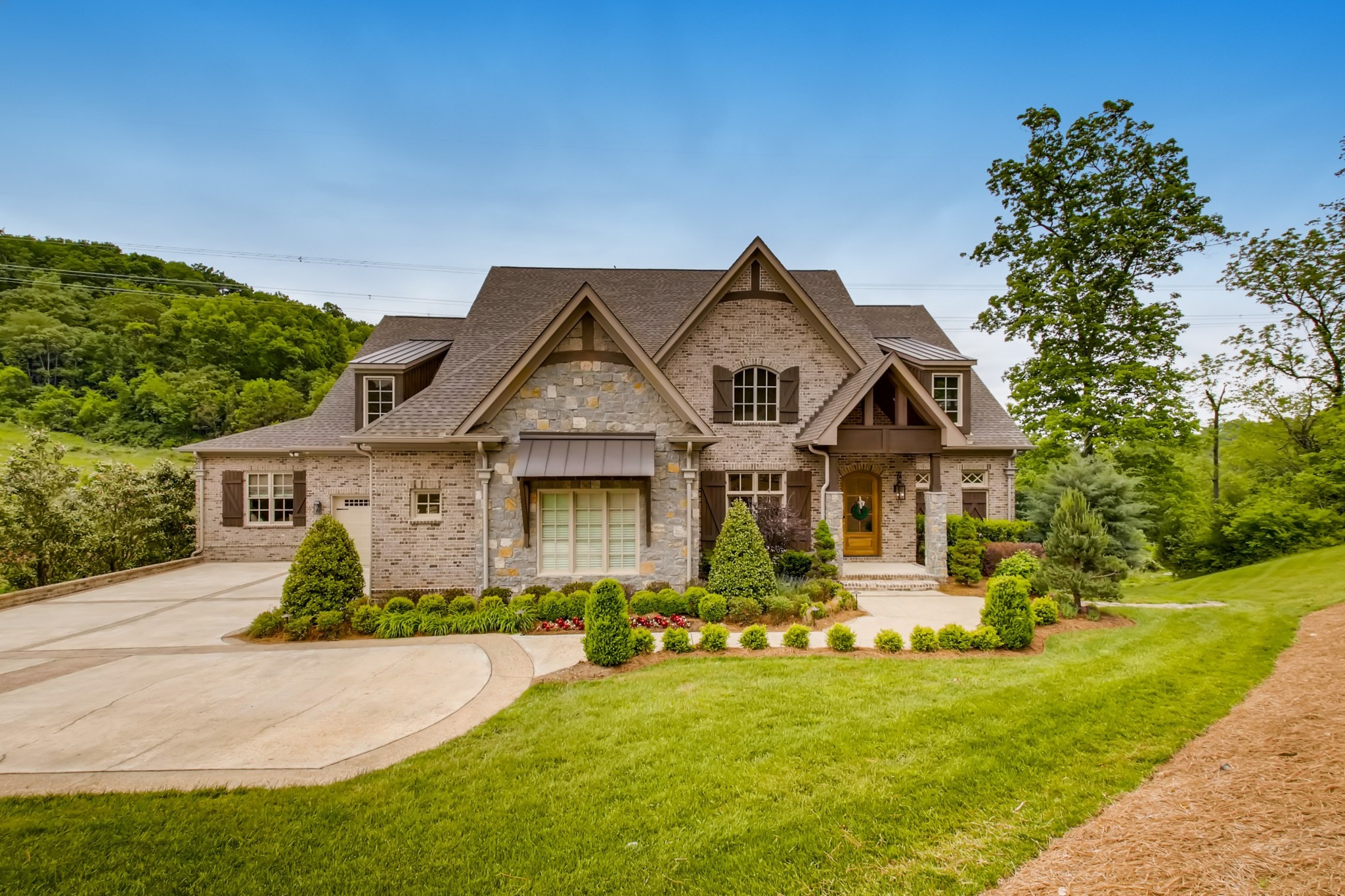 a front view of a house with a yard
