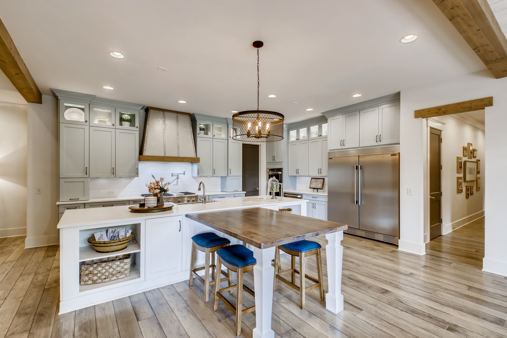 637 Legends Crest Drive Franklin, TN 37069 - Photo 17 of 50 a kitchen with refrigerator a sink and chairs