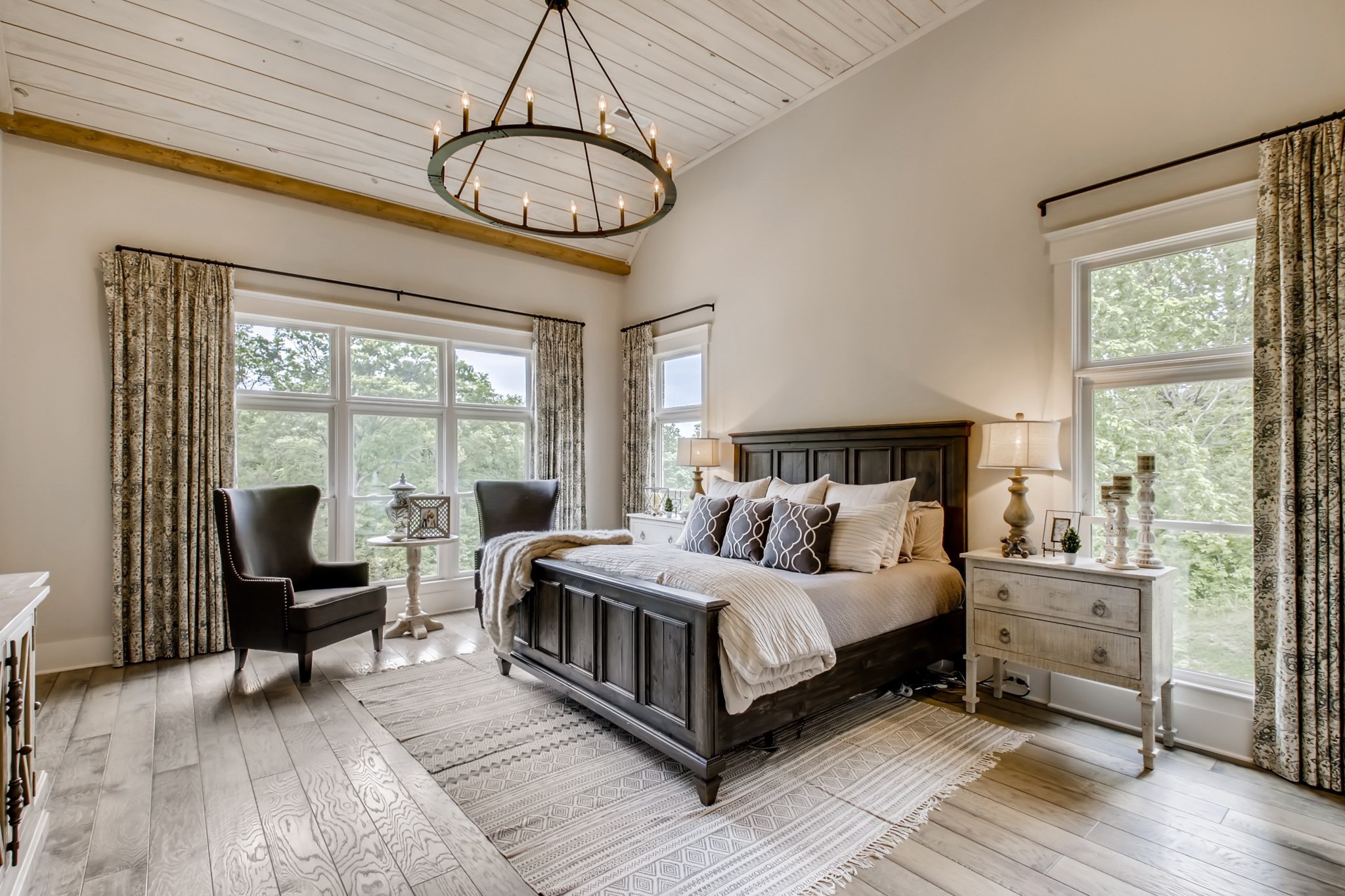 637 Legends Crest Drive Franklin, TN 37069 - Photo 20 of 50 a bedroom with a large bed and a chandelier