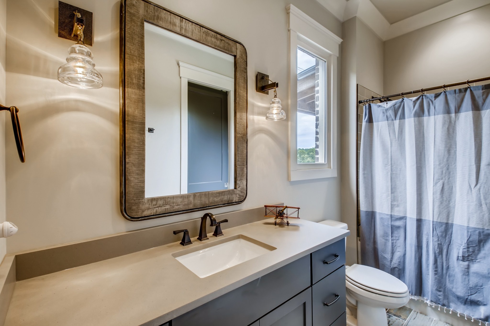 637 Legends Crest Drive Franklin, TN 37069 - Photo 29 of 50 a bathroom with a sink a toilet and shower