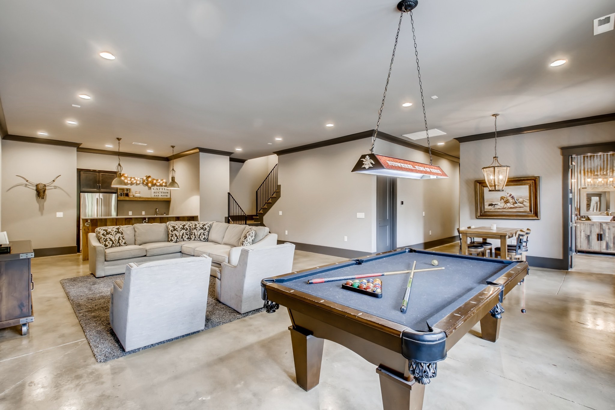637 Legends Crest Drive Franklin, TN 37069 - Photo 42 of 50 a living room with kitchen island furniture and a chandelier