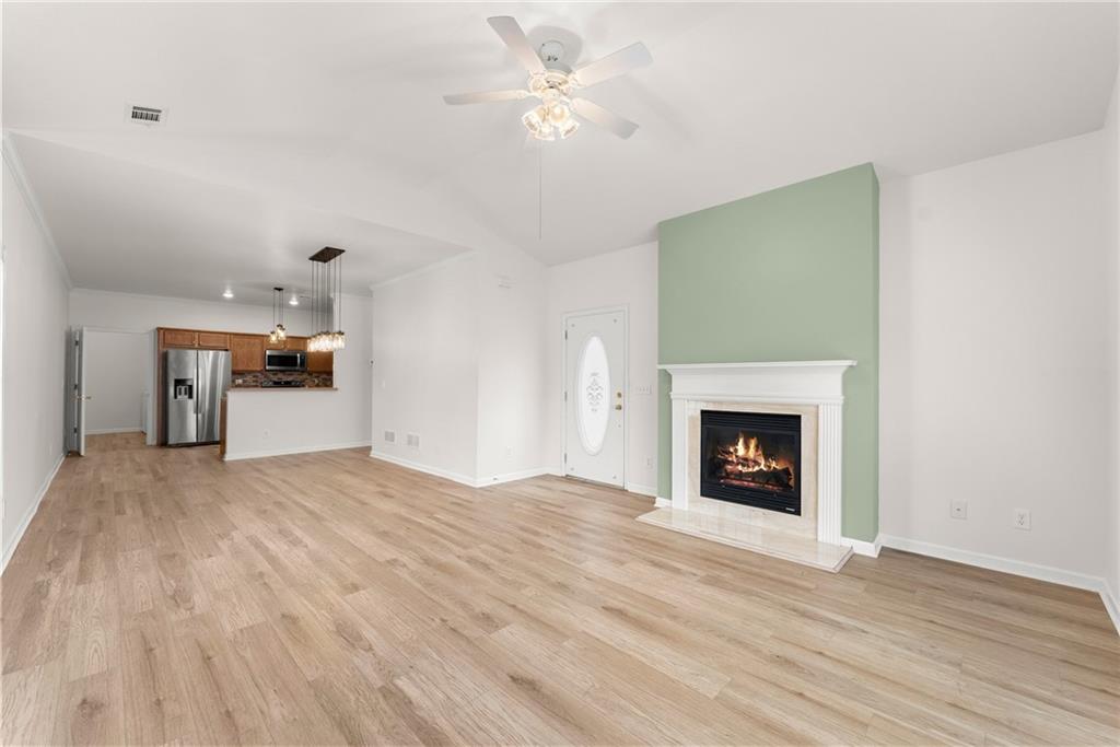 119 Holiday Road, Unit 603 Buford, GA 30518 - Photo 11 of 34 a view of an empty room with a fireplace