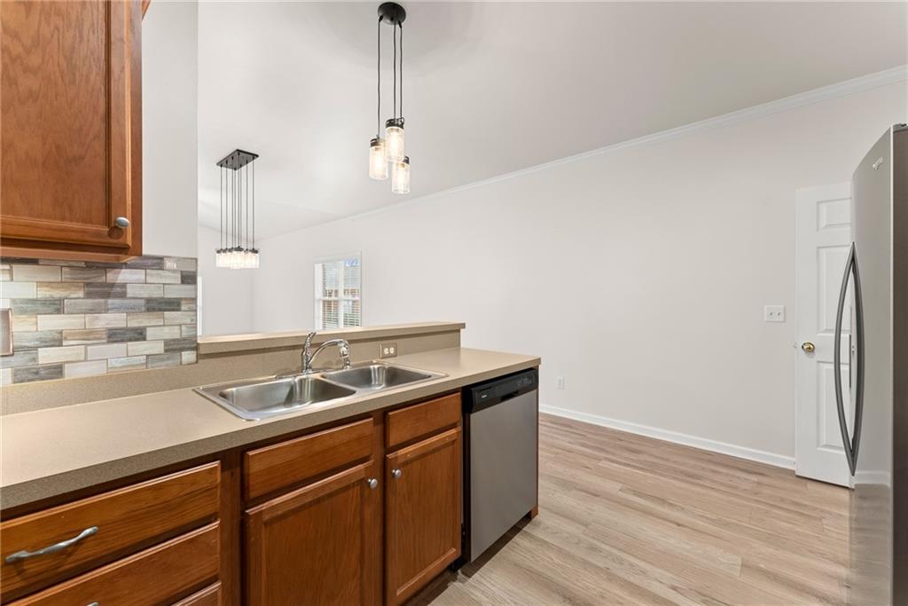 119 Holiday Road, Unit 603 Buford, GA 30518 - Photo 14 of 34 a kitchen with a sink and cabinets