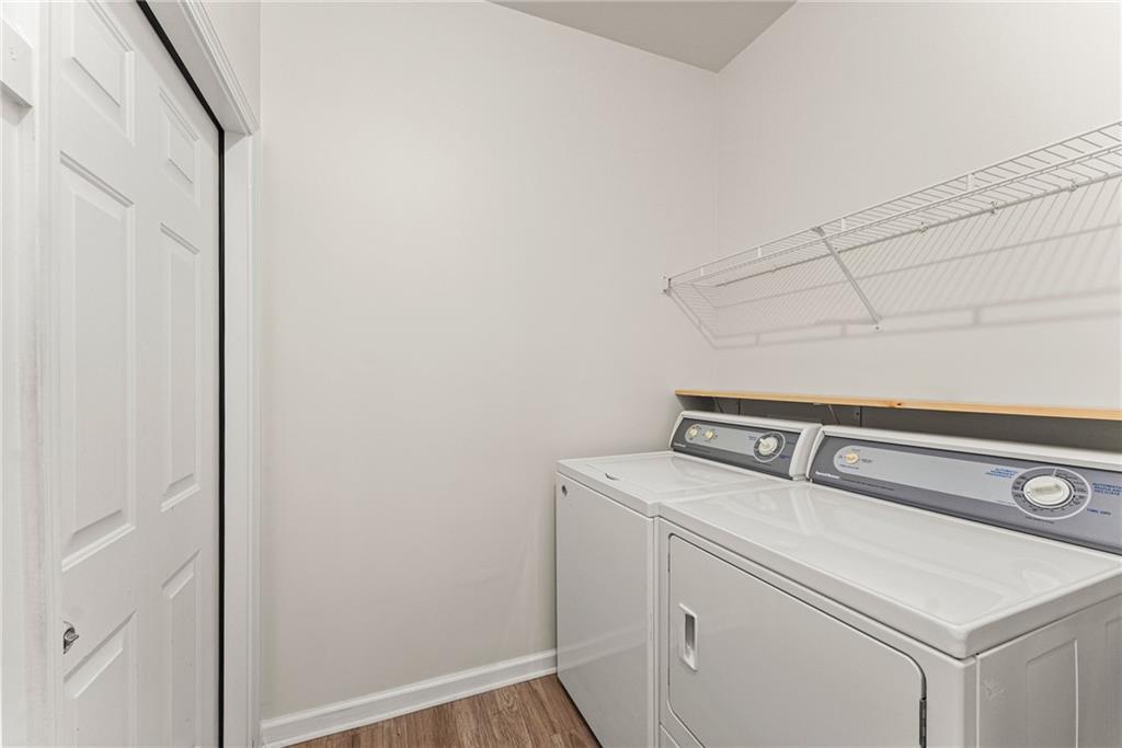 119 Holiday Road, Unit 603 Buford, GA 30518 - Photo 19 of 34 a utility room with dryer and washer