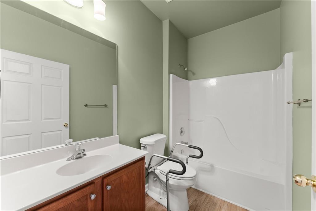 119 Holiday Road, Unit 603 Buford, GA 30518 - Photo 20 of 34 a bathroom with a sink and a mirror