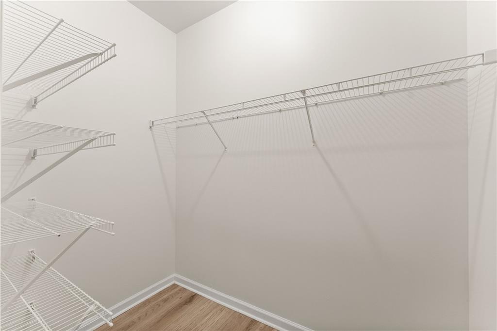 119 Holiday Road, Unit 603 Buford, GA 30518 - Photo 30 of 34 a view of a room with racks on the wall