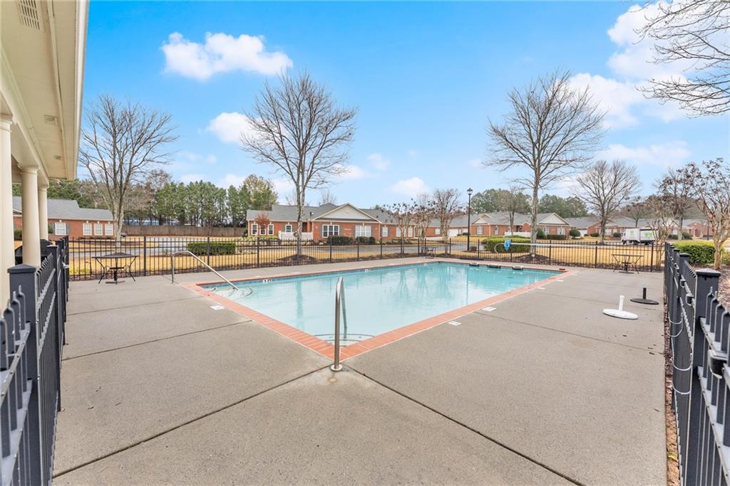119 Holiday Road, Unit 603 Buford, GA 30518 - Photo 32 of 34 a view of a swimming pool and outdoor space