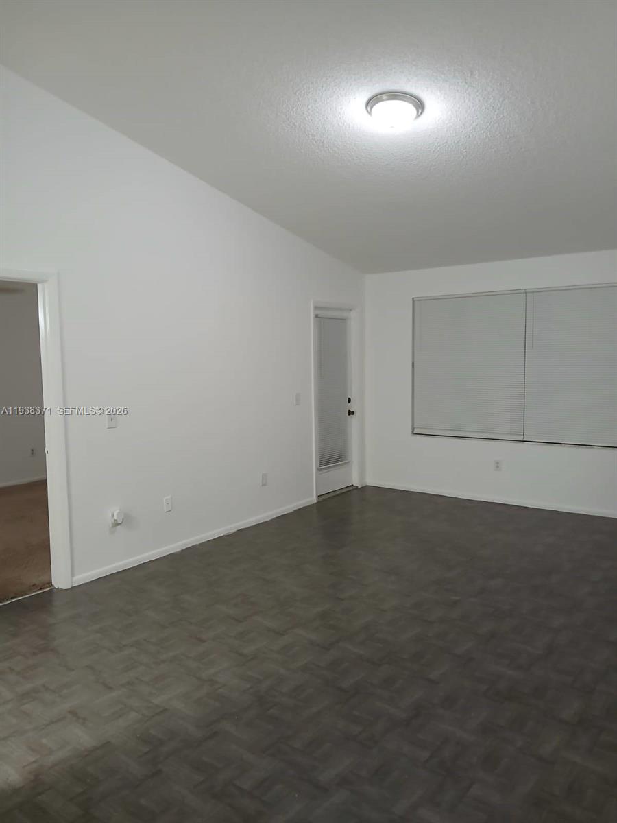 4521 West McNab Road, Unit 21 Pompano Beach, FL 33069 - Photo 13 of 18 an empty room with a space