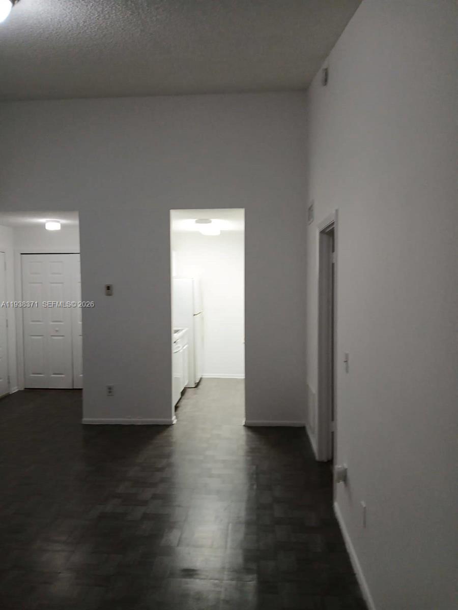 4521 West McNab Road, Unit 21 Pompano Beach, FL 33069 - Photo 5 of 18 a view of a room with wooden floor