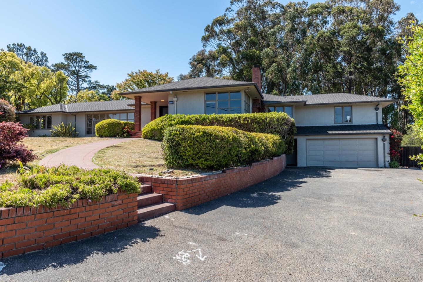 860 Longview Road Hillsborough, CA 94010 - Photo 1 of 42 front view of a house with a yard