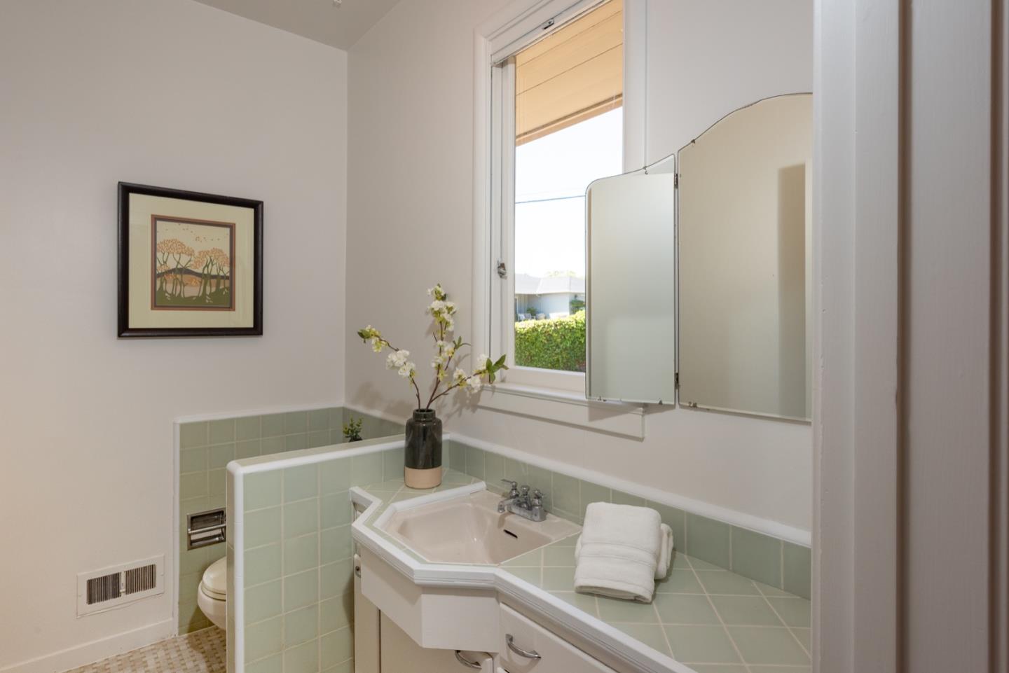 860 Longview Road Hillsborough, CA 94010 - Photo 14 of 42 a bathroom with a sink and a mirror