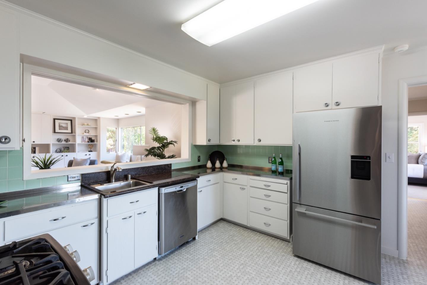 860 Longview Road Hillsborough, CA 94010 - Photo 15 of 42 a kitchen with white cabinets and white appliances