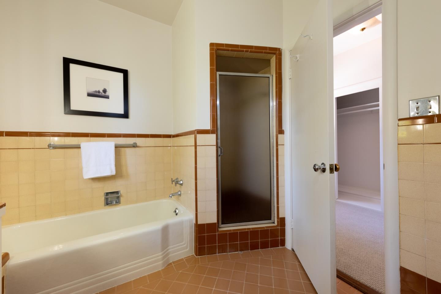 860 Longview Road Hillsborough, CA 94010 - Photo 23 of 42 a bathroom with a bathtub and a shower
