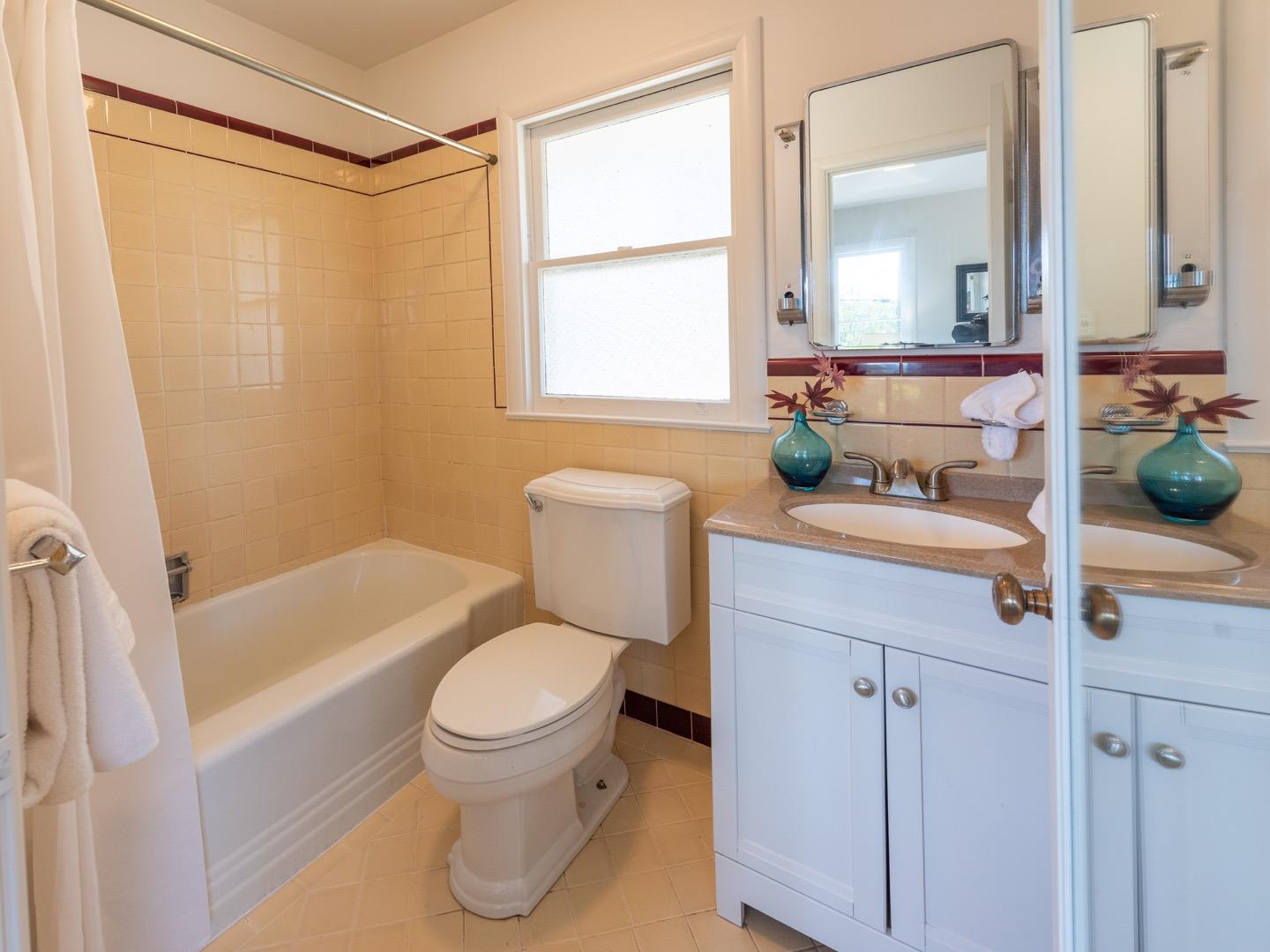 860 Longview Road Hillsborough, CA 94010 - Photo 29 of 42 a bathroom with a sink a toilet and a mirror