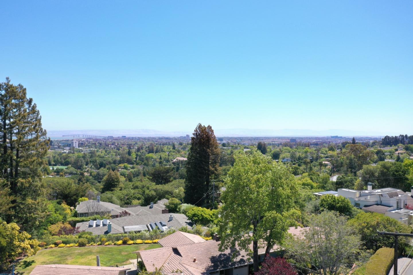 860 Longview Road Hillsborough, CA 94010 - Photo 3 of 42 a view of a city with lush green forest