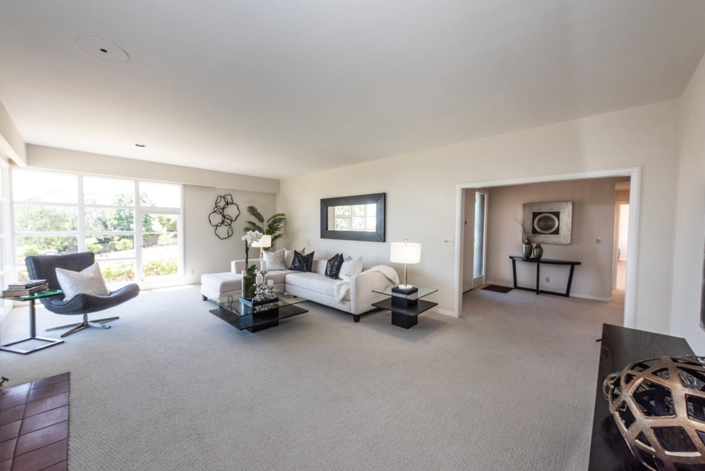 860 Longview Road Hillsborough, CA 94010 - Photo 8 of 42 a living room with furniture and a large window