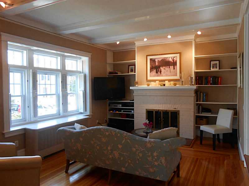42 Scott Street, Unit 2 Pawtucket, RI 02860 - Photo 9 of 25 Living Room. The fireplace and wood floors add charm and warmth to the living room.