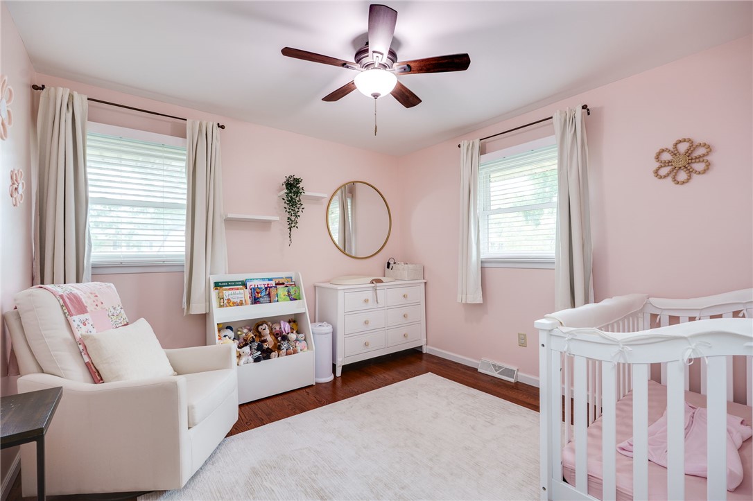 6950 Red Lion 5 Points Road Springboro, OH 45066 - Photo 34 of 78 This bright nursery features warm wood flooring and ample natural light, creating a serene space.