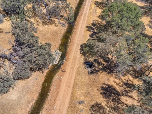 a room with a fireplace and gym equipment